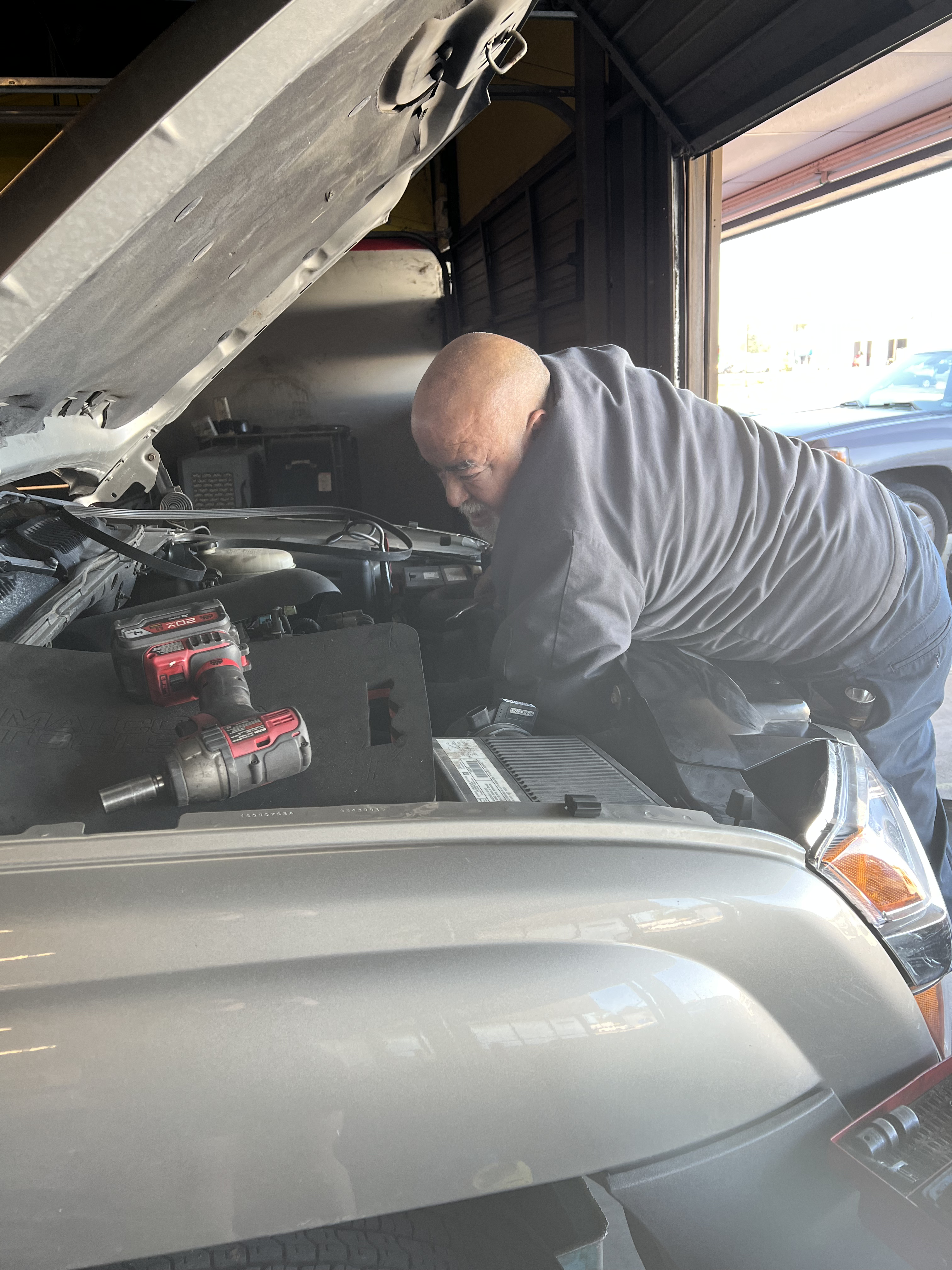 Car engine being worked on
