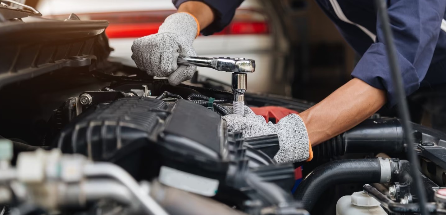 Mechanic doing a car tune-up